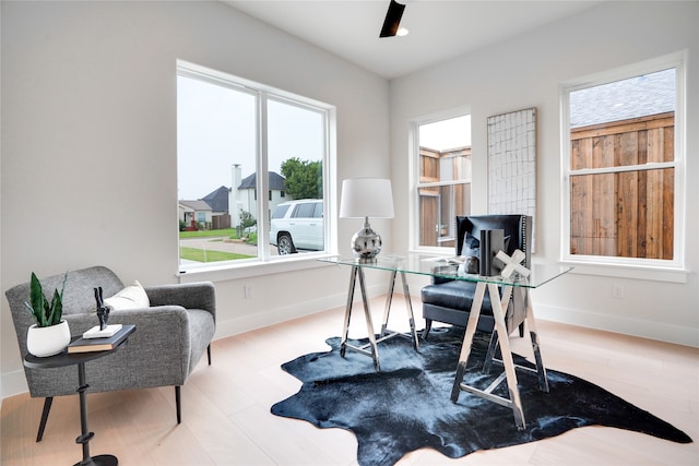 home office with hardwood / wood-style flooring