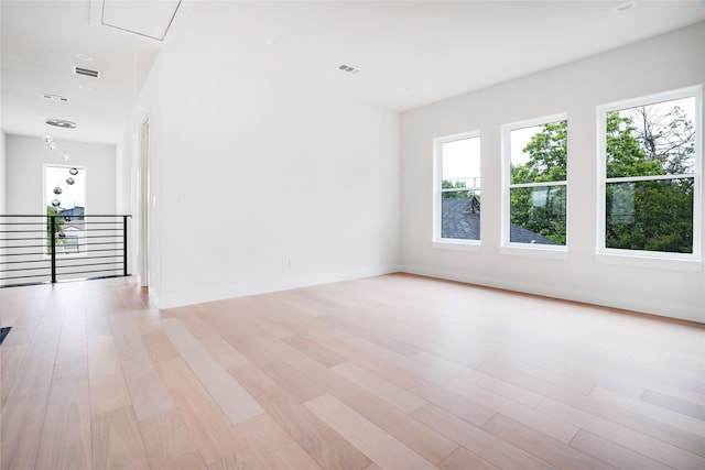 unfurnished room featuring light wood-type flooring