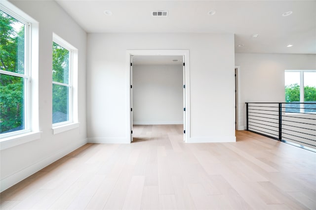 spare room with light wood-type flooring