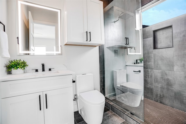 bathroom featuring tile flooring, an enclosed shower, vanity, and toilet