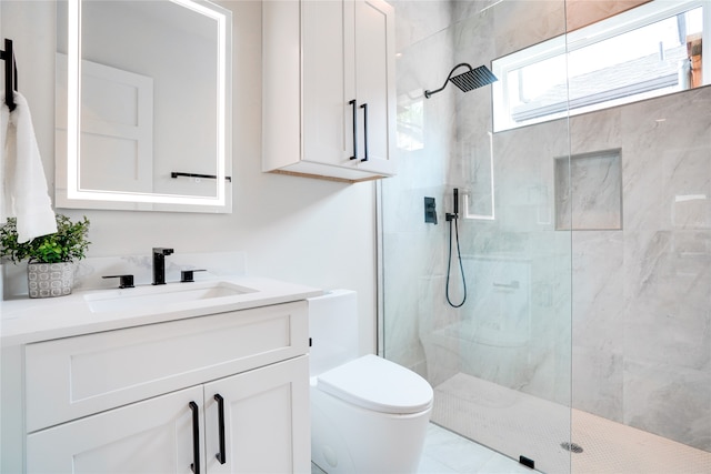 bathroom featuring an enclosed shower, tile flooring, large vanity, and toilet