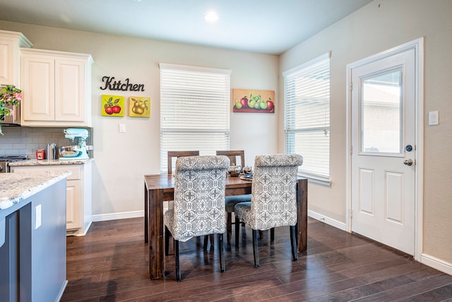 dining space featuring dark hardwood / wood-style floors