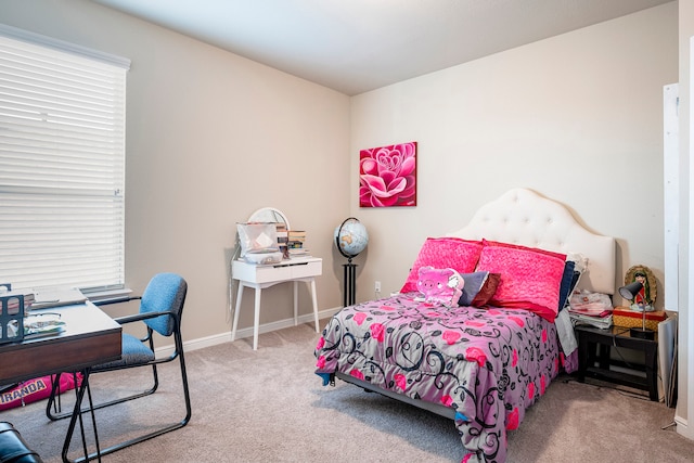 bedroom featuring light carpet