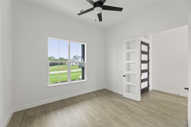 unfurnished bedroom featuring ceiling fan and light hardwood / wood-style flooring