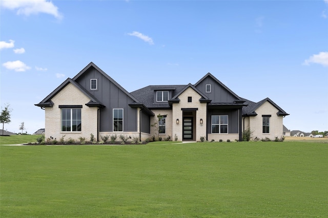 modern farmhouse featuring a front yard