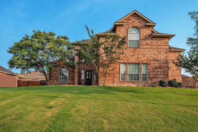 back of property featuring a yard