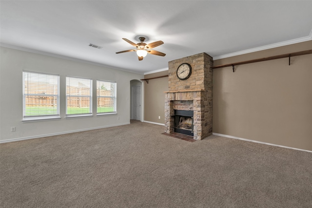 unfurnished living room with a fireplace, carpet flooring, and ornamental molding