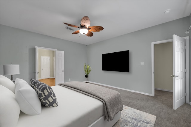 carpeted bedroom featuring ceiling fan