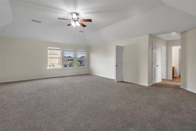 empty room featuring carpet flooring, ceiling fan, and lofted ceiling