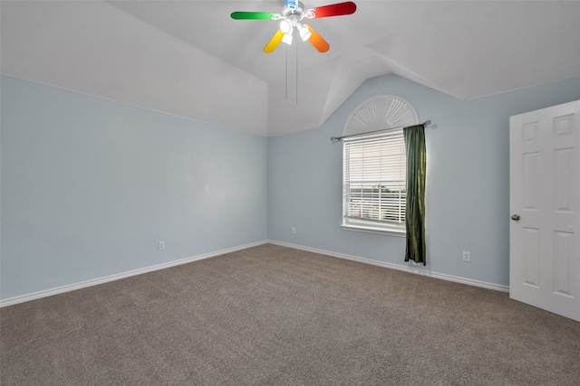 spare room with carpet, ceiling fan, and lofted ceiling