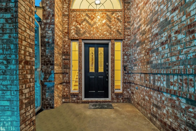 entrance to property with brick siding