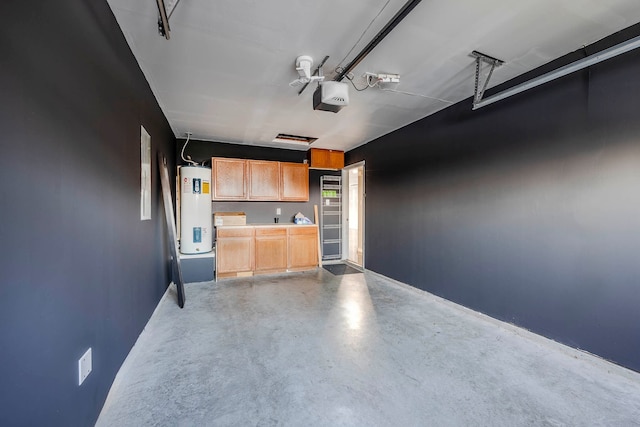 garage featuring water heater and a garage door opener