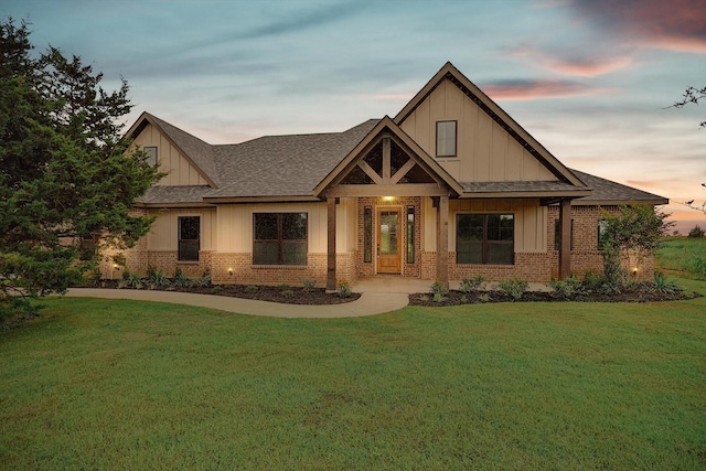 view of front of property with a lawn