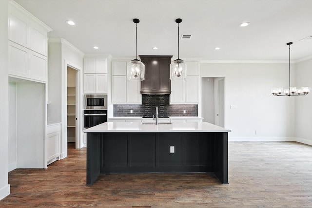 kitchen featuring a kitchen island with sink, dark wood-type flooring, white cabinets, and wall oven