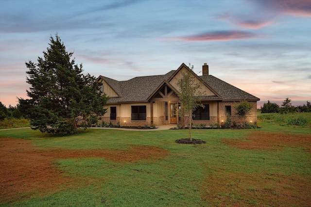 craftsman inspired home with a lawn