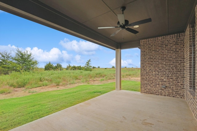 view of patio with a rural view and ceiling fan