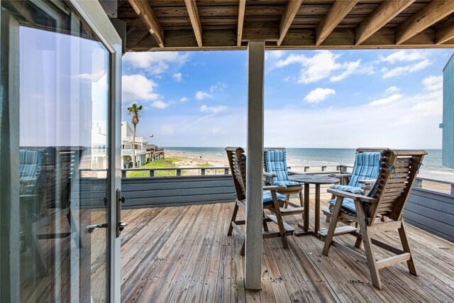 wooden terrace with a water view