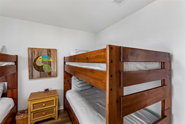 bedroom with wood-type flooring