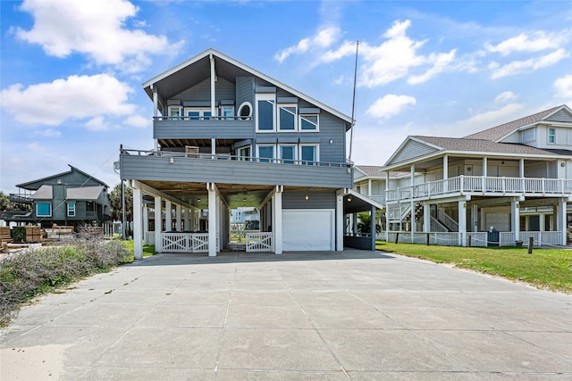 view of front of home featuring a garage and a balcony