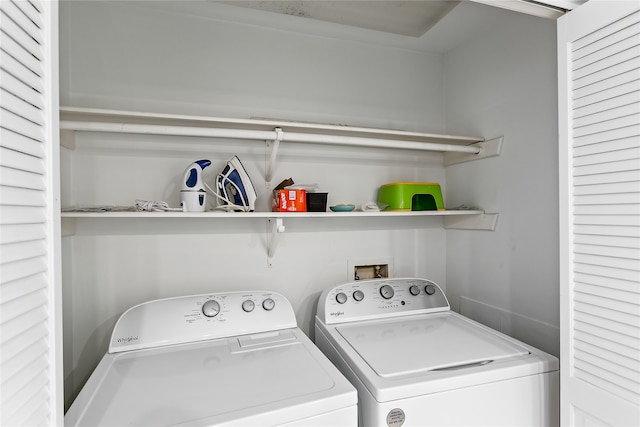 clothes washing area with separate washer and dryer