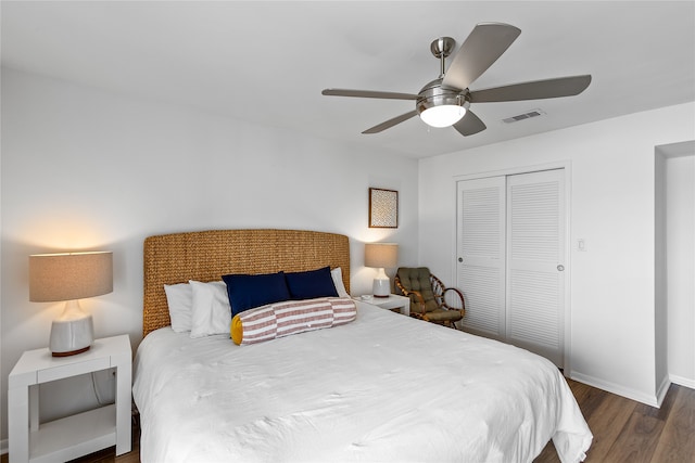 bedroom featuring a closet, ceiling fan, and dark wood-type flooring