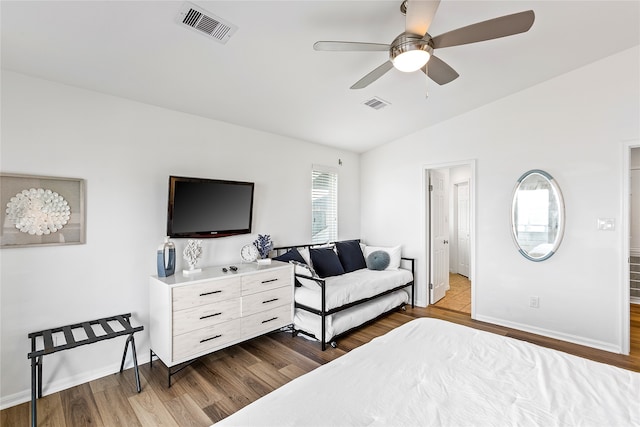 bedroom featuring lofted ceiling, ceiling fan, and tile floors