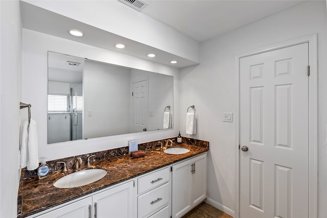 bathroom with tile flooring and dual bowl vanity