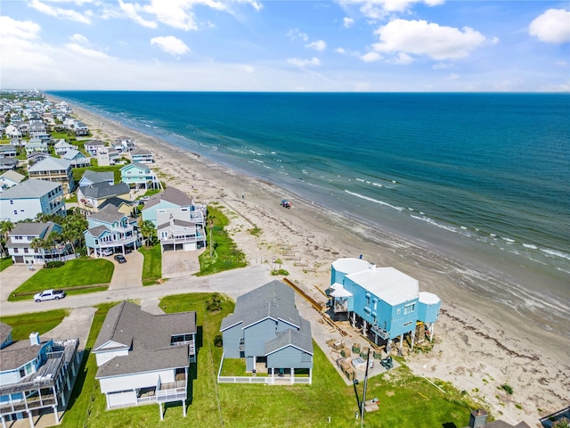 aerial view with a water view and a view of the beach