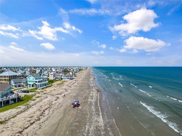 birds eye view of property featuring a view of the beach and a water view