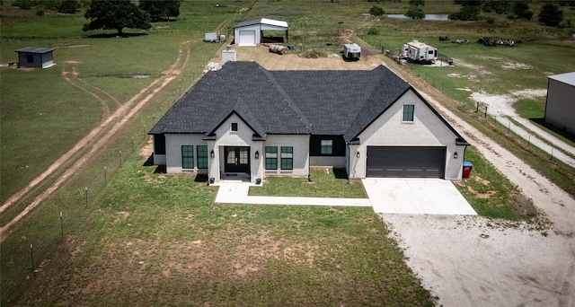 view of front facade with a front lawn and a garage