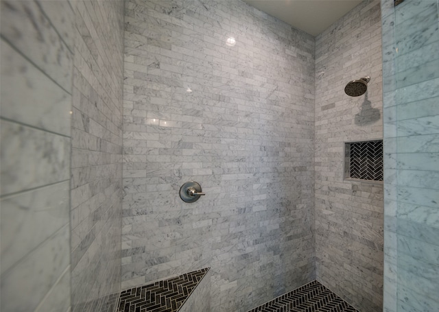 bathroom with a tile shower