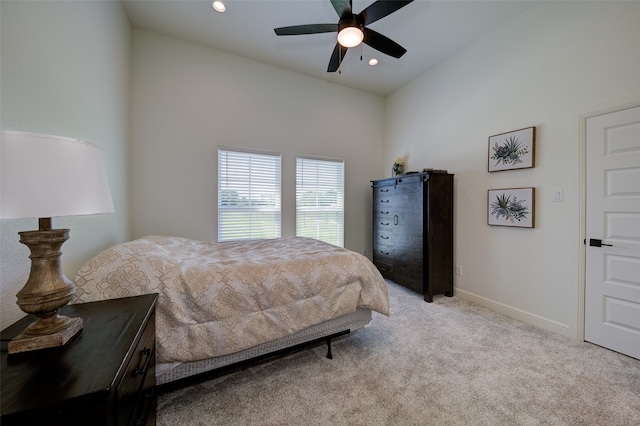 bedroom featuring ceiling fan and light colored carpet