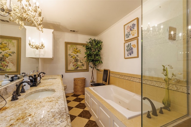 bathroom featuring vanity, crown molding, and a bathtub