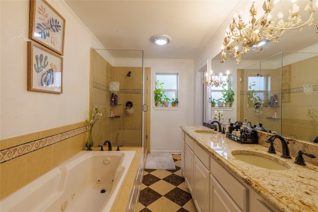 bathroom with vanity, crown molding, independent shower and bath, and an inviting chandelier