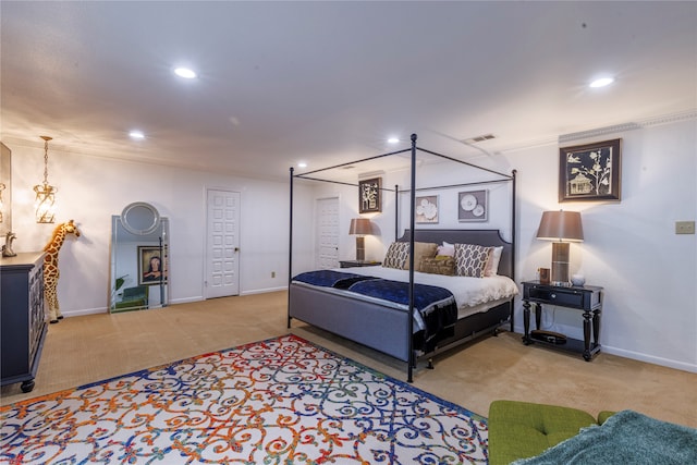 bedroom with carpet and crown molding