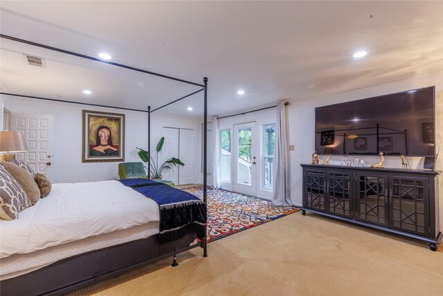 carpeted bedroom featuring access to outside