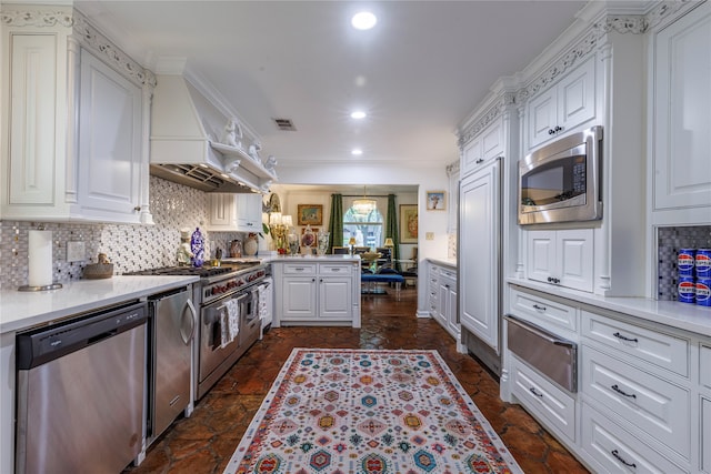 kitchen with kitchen peninsula, white cabinetry, stainless steel appliances, and premium range hood