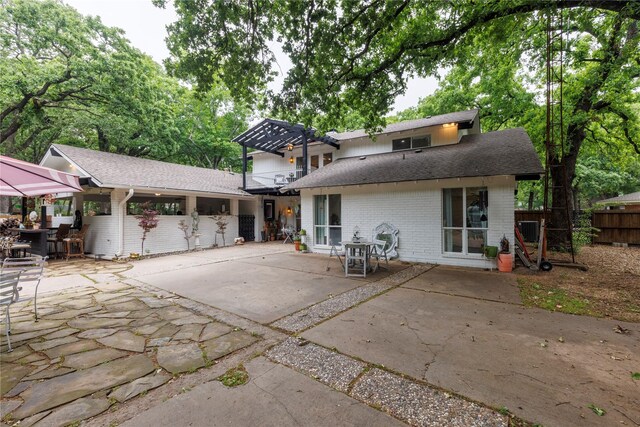 back of property with a patio area