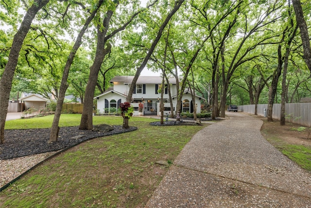 view of front of house with a front yard and a porch