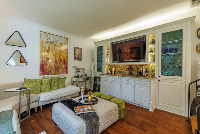 living room featuring crown molding and dark hardwood / wood-style floors