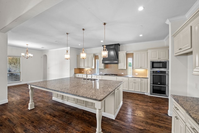 kitchen featuring dark hardwood / wood-style flooring, a kitchen breakfast bar, custom exhaust hood, sink, and appliances with stainless steel finishes