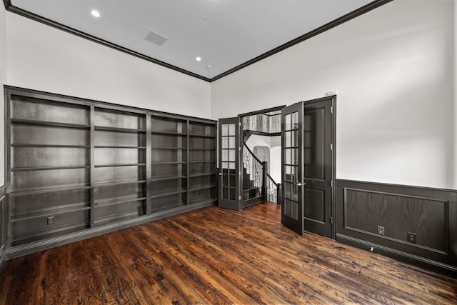 interior space with ornamental molding, dark wood-type flooring, and french doors