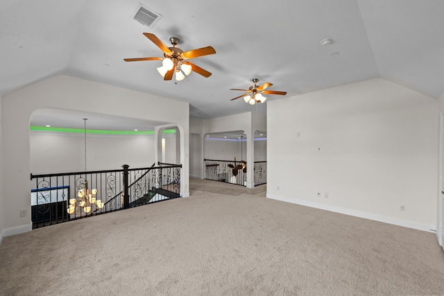 spare room with light colored carpet, ceiling fan, and lofted ceiling