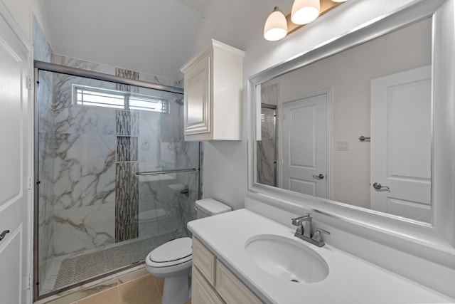 bathroom with tile flooring, an enclosed shower, vanity, and toilet