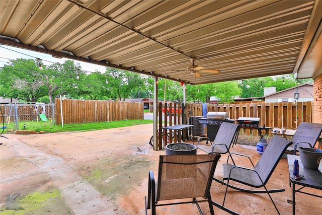 view of patio / terrace featuring ceiling fan and a playground