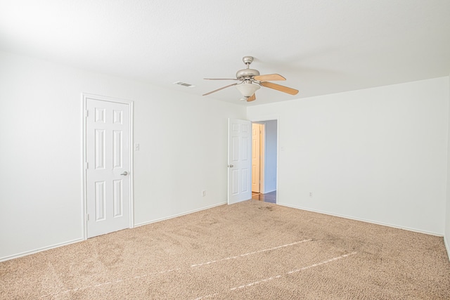 carpeted empty room with ceiling fan