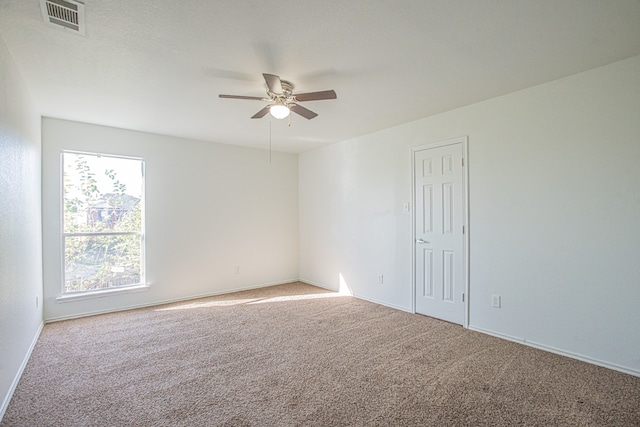 empty room with carpet and ceiling fan