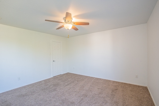 empty room with carpet floors and ceiling fan