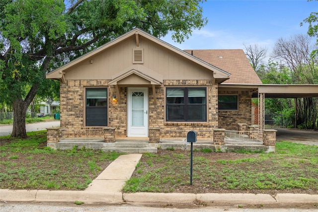 view of front of property with a carport