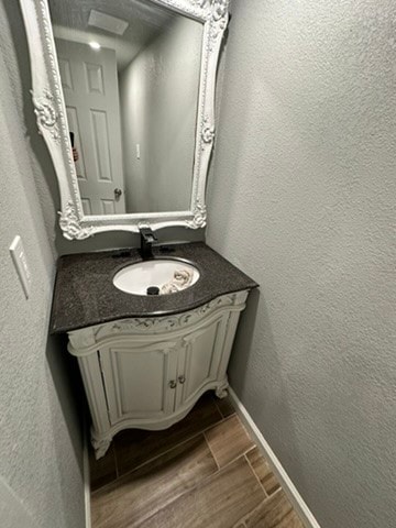 bathroom featuring tile floors and vanity